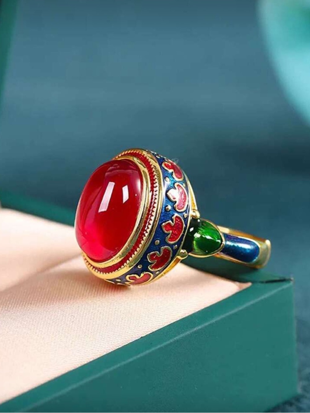 Golden Ring with Red Cabochon and Enamel Accents